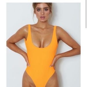 Tangerine colored one piece bathing suit